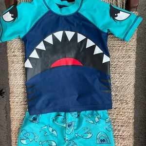 Rashguard and swim trunks